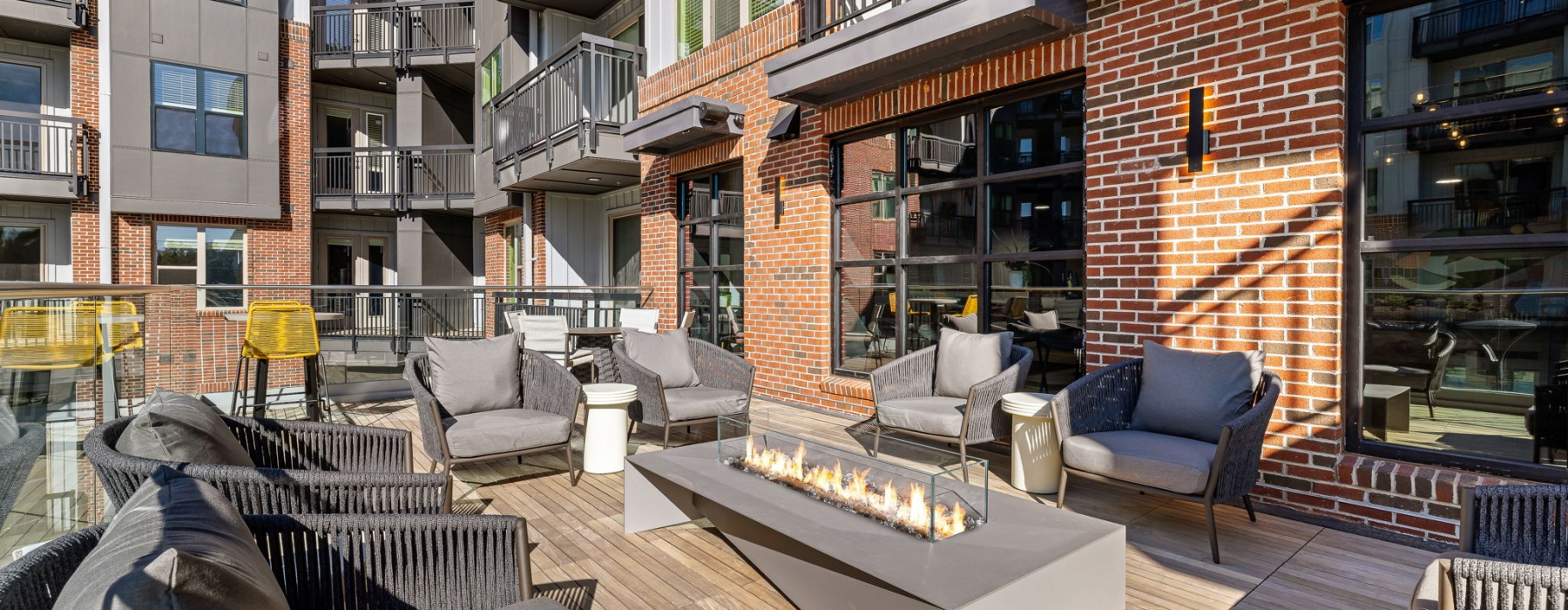 Terrace with seating and firepit off the main clubhouse