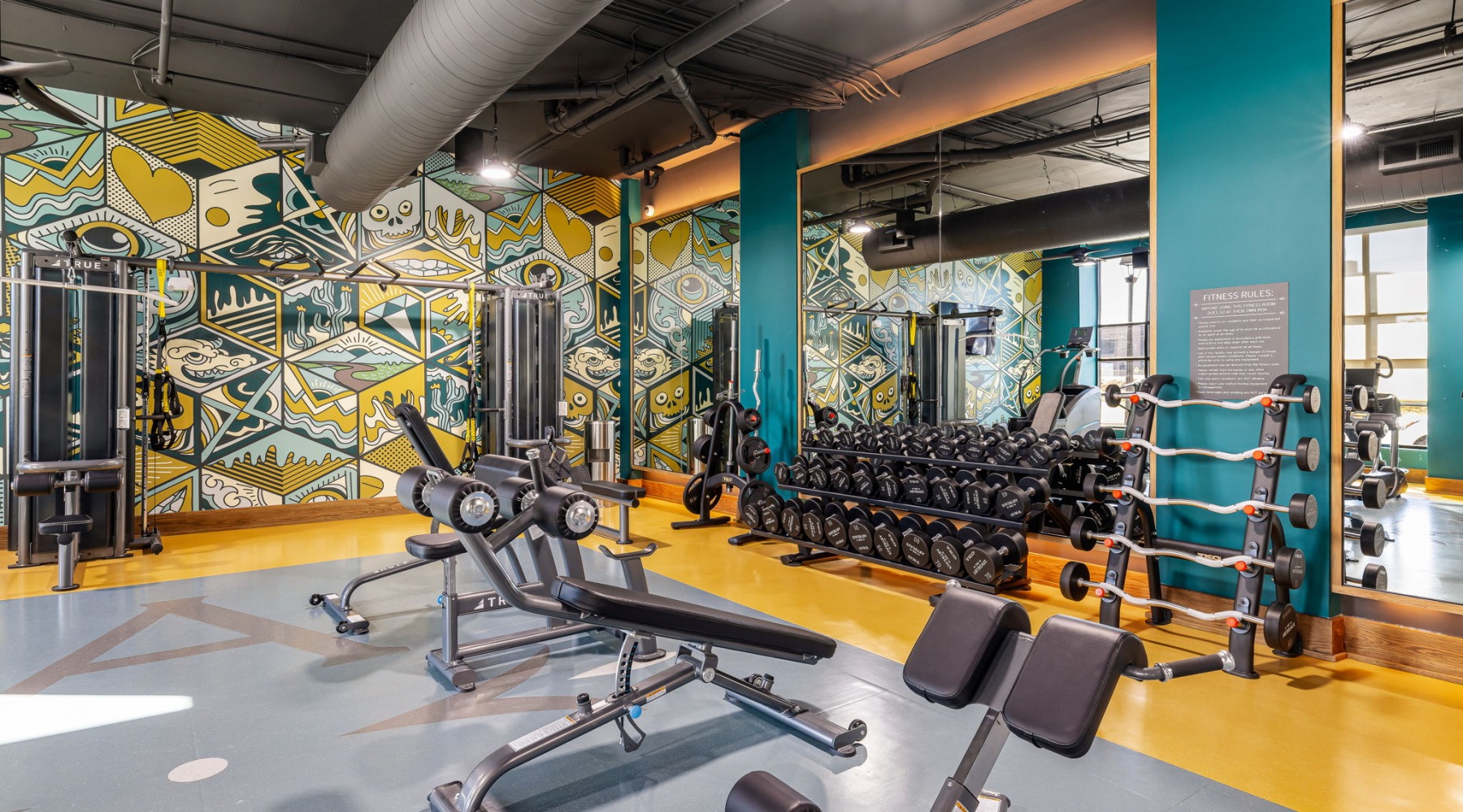 A fitness center with treadmills and free weights at The Artreaux apartments in Winston-Salem. A fitness center with treadmills and free weights at The Artreaux apartments in Winston-Salem.