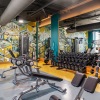 Fully equipped fitness center with weights and TRX 