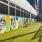 Pet park with bench seating and a mural